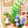 RoboTime 3D wooden puzzle Miniature house Sitting with tea in a blooming garden
